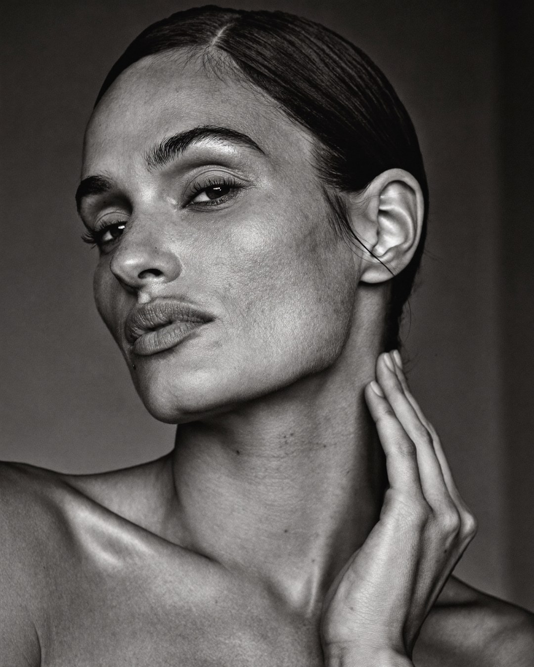 An elegant woman with a defined jawline and naturally lifted face